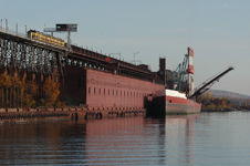 LTV Mining train at the Taconite Harbor dock with boat.