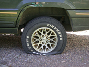 Flat tire on the jeep while camping.