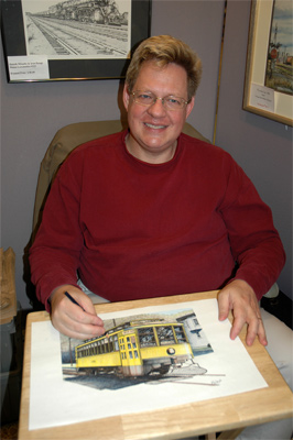 John handcoloring a drawing at his booth.